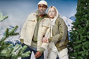 stylish multiracial couple in warm winter