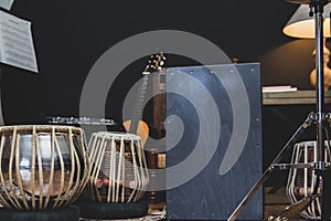 Stylish musician playing the Cajon drums.