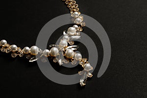 Stylish necklace with gemstones on black backgrount. Luxury jewelry