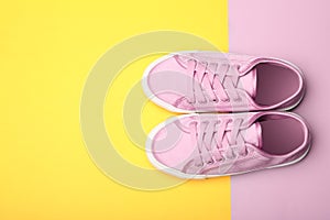 Stylish new shoes on color background