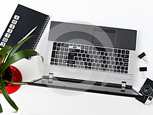 Stylish office table desk. Workspace with laptop, diary, succulent on white background. Flat lay, top view.