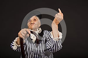 Old grandma in a white-black striped jacket photo