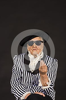 Old grandma in a white-black striped jacket photo