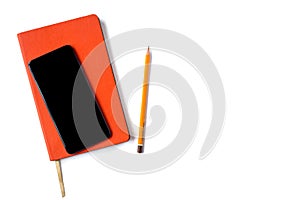 Stylish orange day planner with leather cover, smartphone and a pencil isolated on white background