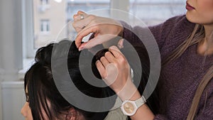 Stylish pan-asian girl at hairdresser