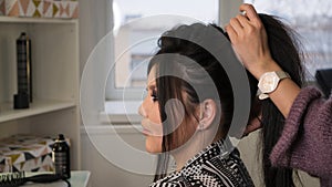 Stylish pan-asian girl at hairdresser
