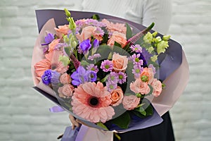 Stylish pink bouquet on a white background.