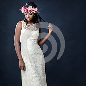 Stylish portrait of african bride with flower crown.