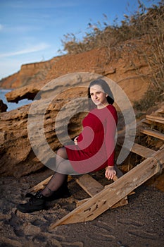 Stylish pregnant woman. Beautiful young pregnant woman enjoying the sunset. Pregnant tummy