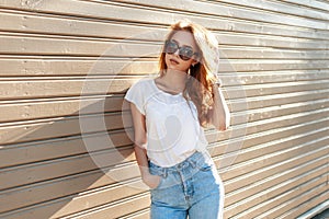 Stylish pretty hipster woman in sunglasses and vintage high photo
