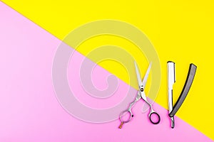 Stylish Professional Barber Scissors on yellow and pink background. Hairdresser salon concept, Hairdressing Set. Haircut