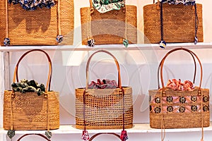 Stylish rattan handbags on the storefront. Bali island.