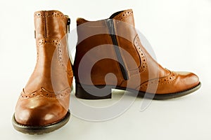 Stylish real leather ankle boots isolated on a whte background.