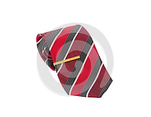 Stylish red striped rolled necktie and gold colored tie pin isolated on white