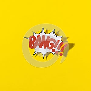 stylish retro comic speech bubble with text bang yellow background. High quality photo