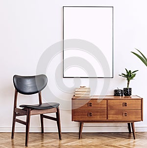 Stylish and retro living room with design vintage wooden commode, chair and elegant personal accessories. Mock up poster.