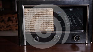 Stylish retro radio player, retro broadcast radio receiver circa 1950 against a vintage interior