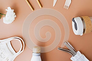 Stylish reusable eco friendly items on brown background