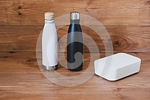 Stylish reusable eco friendly items on wooden background.