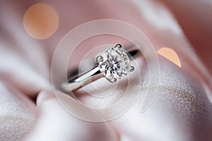 Stylish rings, flowers on wooden table background. Letters from the bride and groom. Vows. Engagement. Luxury marriage and wedding