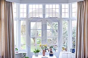 Stylish room interior with french doors and light neutral colours in a modern home