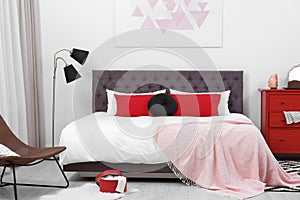 Stylish room interior with large bed