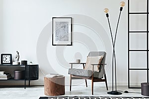 Stylish scandinavian composition of living room with design armchair, black mock up poster frame, commode, wooden stool, lamp,