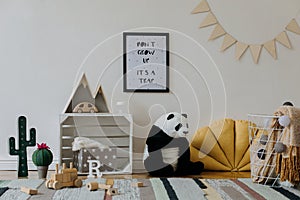 Stylish scandinavian kid room with mock up poster, toys, teddy bear, plush animal, natural pouf and children accessories.