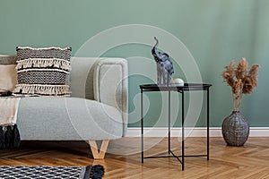 Stylish, Scandinavian living room with mint sofa.