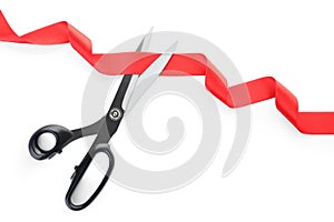 Stylish scissors and red ribbon. Ceremonial tape cutting