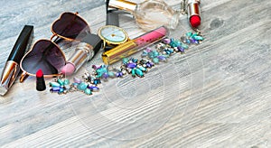 Stylish set of cosmetics and accessories. Sunglasses, lipstick, mascara, eye shadow, lip gloss and pencil. Fashion Style