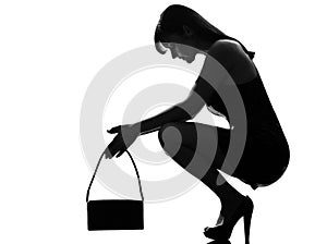 Stylish silhouette woman crouching thinkig despair