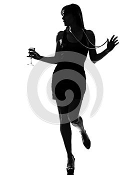 Stylish silhouette woman partying drinkingcocktail