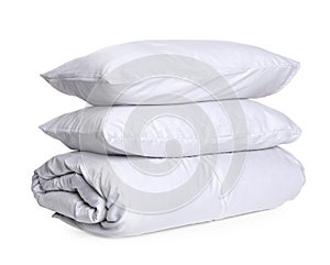 Stylish silky bed linens and pillows on white background