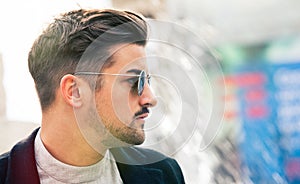 Stylish straight hair. Man profile with sunglasses.