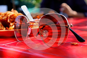 Stylish Sunglasses in background Indian Pakoda selective focus background blur