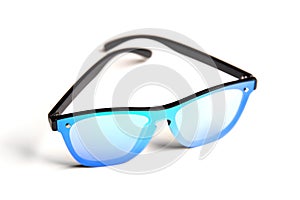 Stylish sunglasses with mirror blue-green glasses isolated on white background