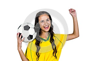 Stylish supporting woman holding football ball rejoicing