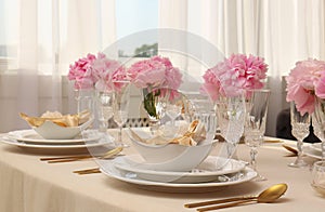 Stylish table setting with beautiful peonies and fabric napkins indoors