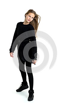 Stylish teenage girl with long hair flying on air