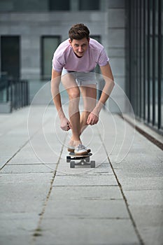 Stylish teenager riding a longboard