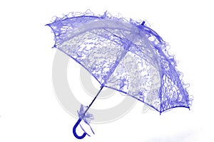 stylish umbrella used in wedding and arti with penbe lace on black background photo