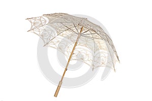 stylish umbrella used in wedding and arti with white lace on white background photo