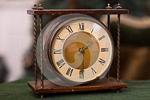 Stylish vintage antique table clock close up