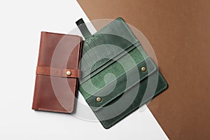 Stylish wallets on color background