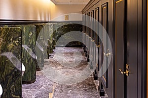 Stylish and wealthy looking men's bathroom in large casino