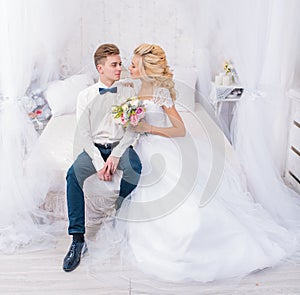 Stylish wedding couple in love interior studio