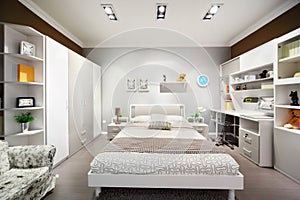 Stylish white-brown bedroom with double bed