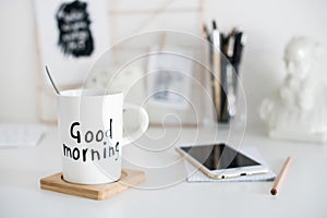 Stylish white desktop, home office interior details with coffee