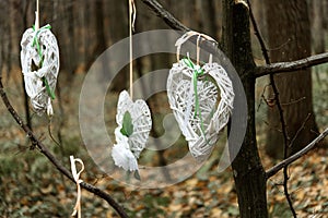 stylish wicker heart in white rustic theme, arrangement for wedding ceremony in forest